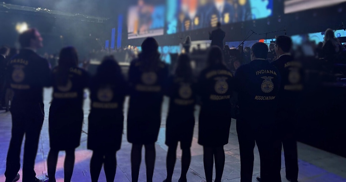 Conner Kesslar stands with friends at FFA convention