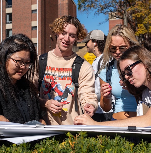 Professor Yiwei Huang teaching students. 