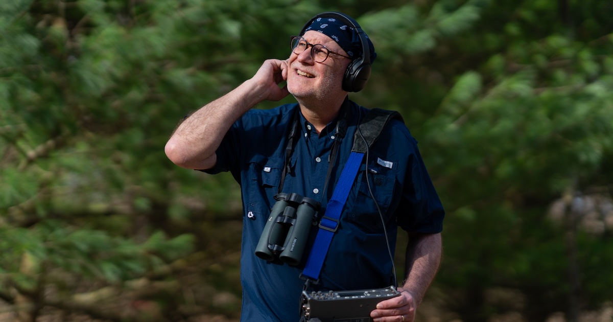 Bryan Pijanowski using technology to listen to Martell Forest in West Lafayette.
