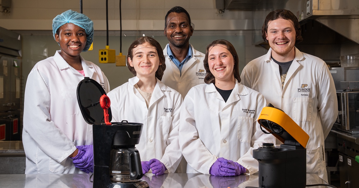 FEMI team for Java House project in lab by coffee makers they tested.