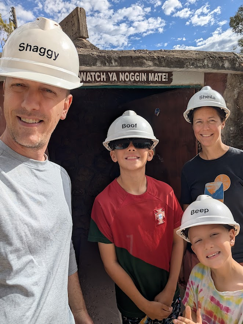 Meyers, his two sons and wife outside of a mine.