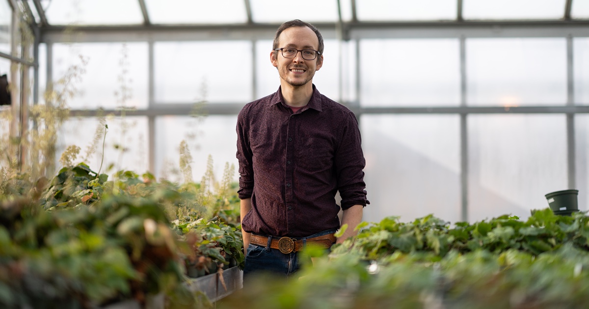 Ryan Folk in a greenhouse.