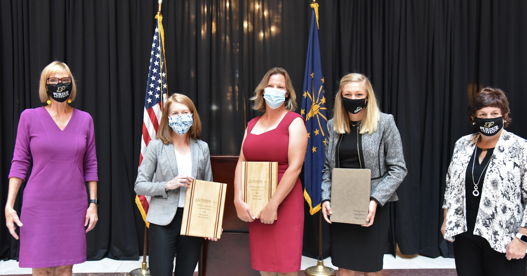 Award recipients with masks