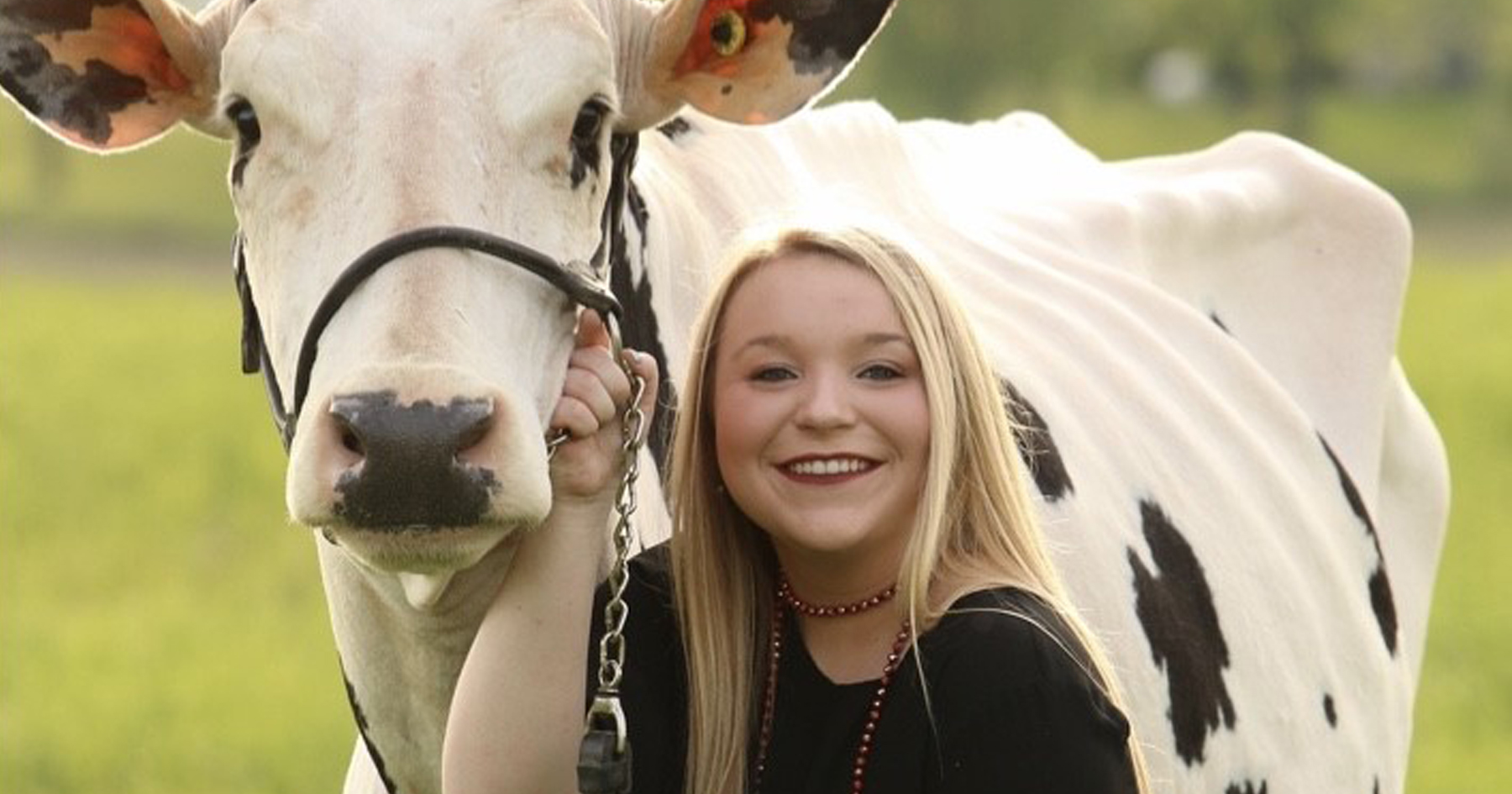 Caitlyn Cox with a cow