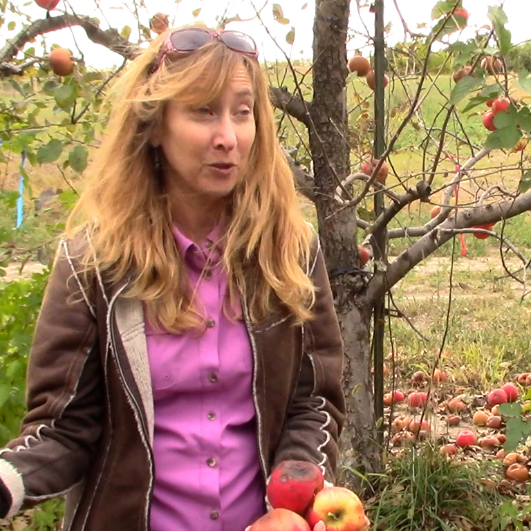 Janna Beckerman in an apple orchard