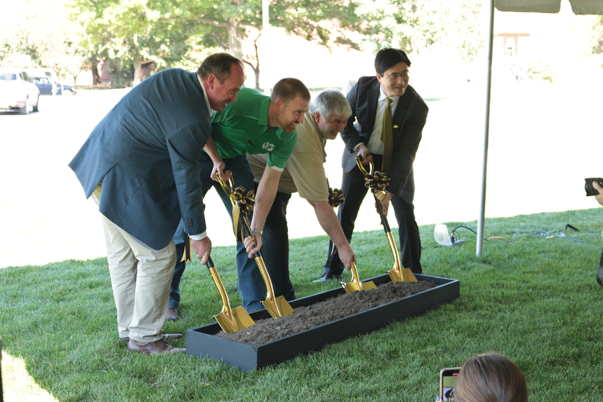 President Mung Chiang, Bernie Engel, Mitch Tuinstra, and Bill Stumph break ground for the new phenotyping greenhouse