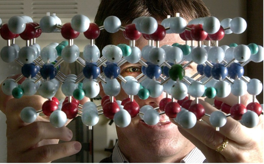 Cliff Johnston looks through a model of a clay molecule