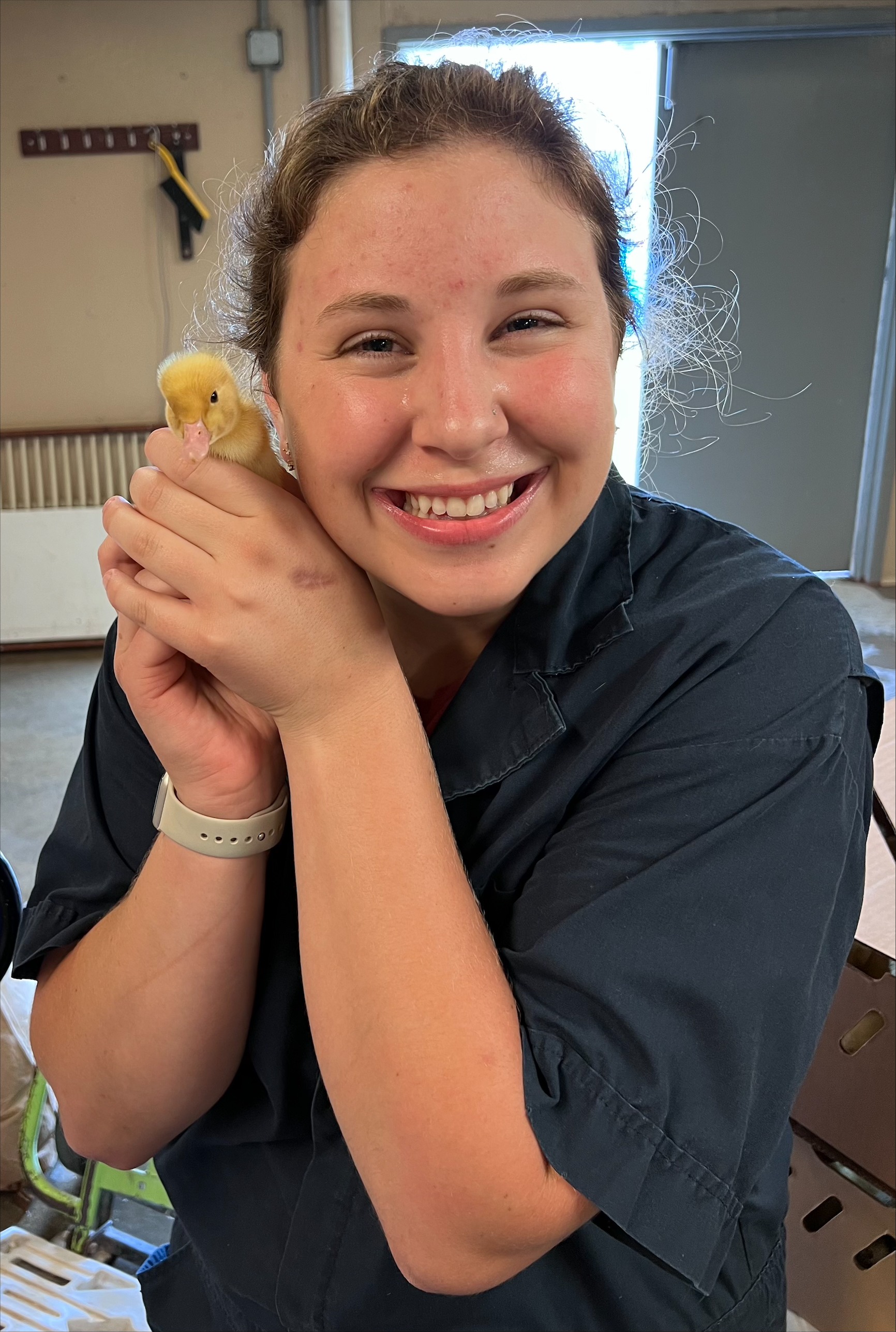 a woman holding a duck