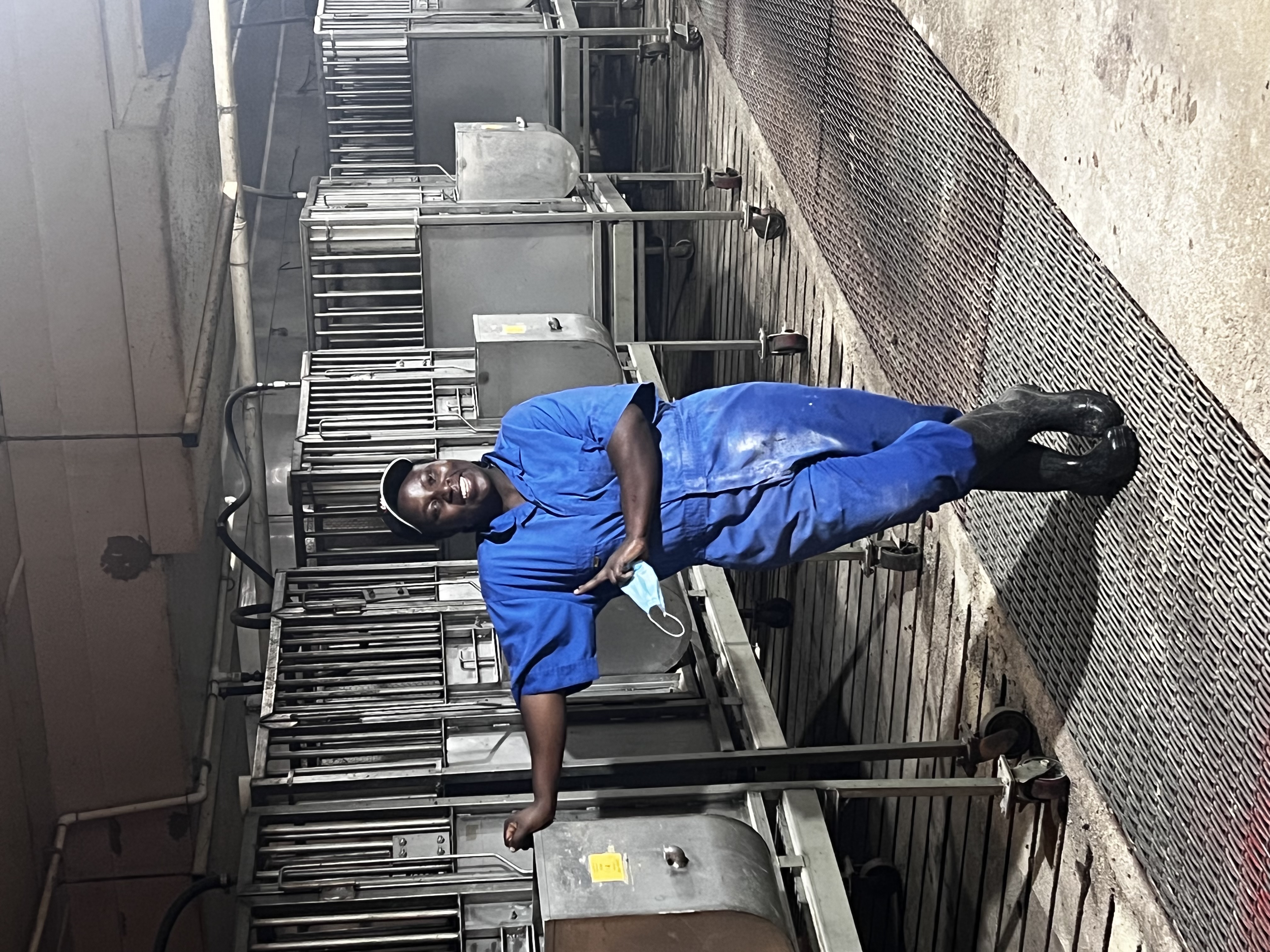 a woman posing in front of equipment