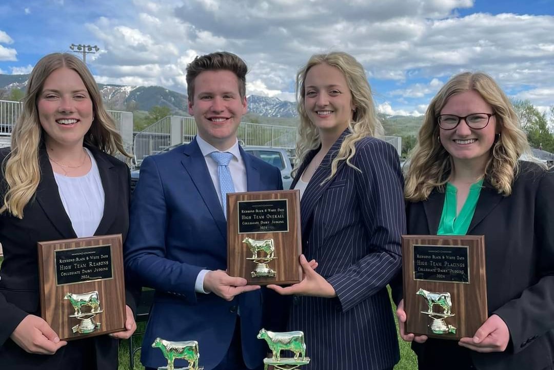 A picture of the dairy judging team with their awards. Pictured from left to right are Emma Townsend, Evan Coblentz, Jackie Mudd, and Alaina Weaver.