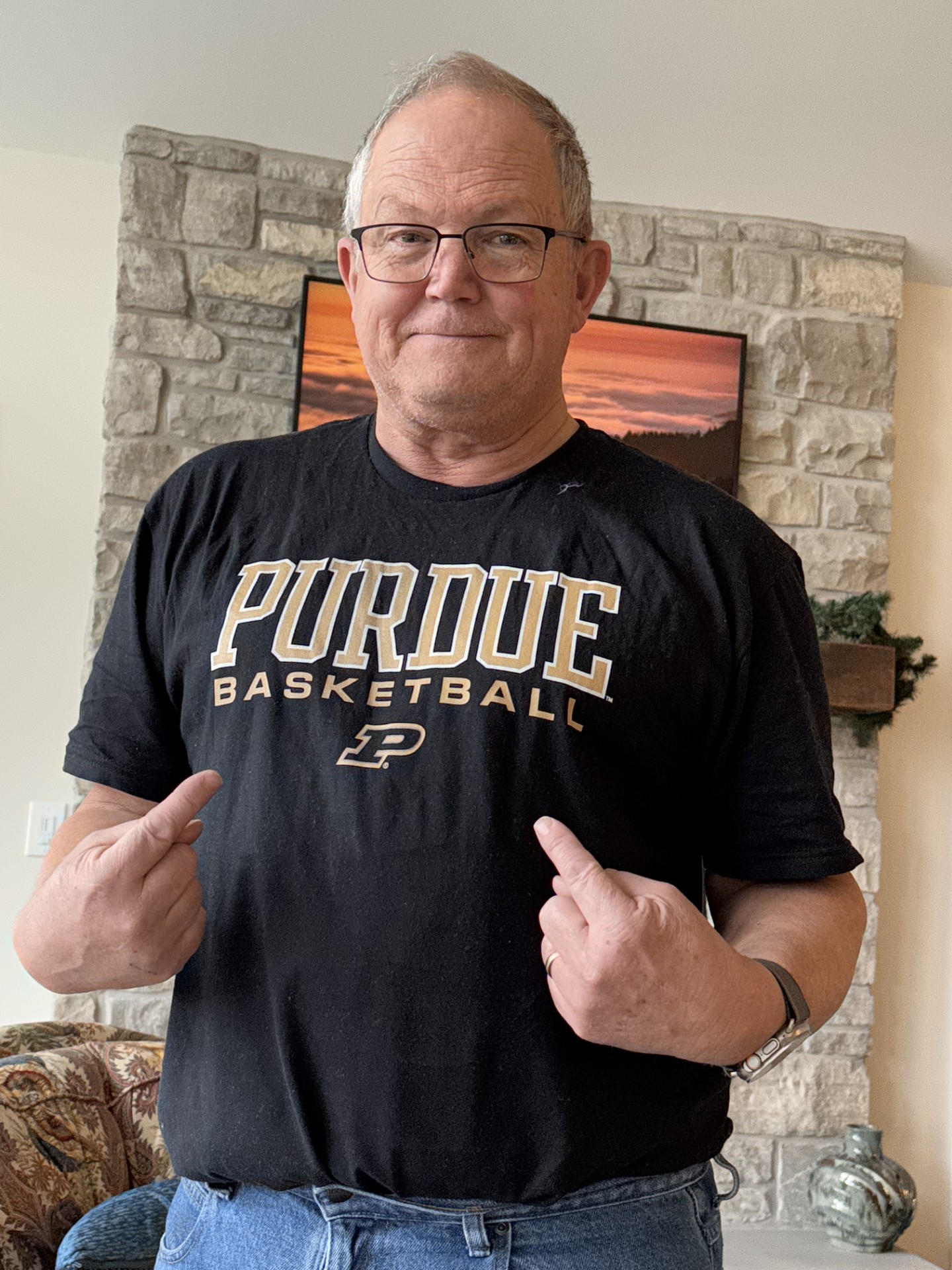 a man wearing a Purdue shirt