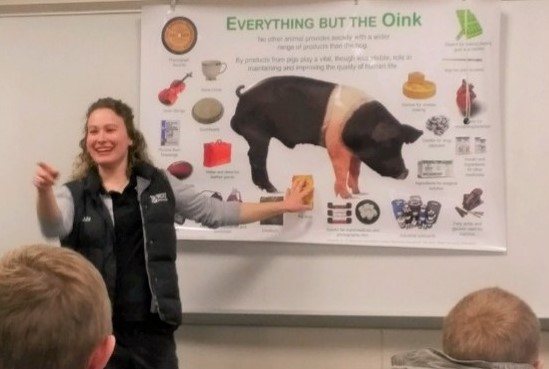 a woman presenting to a group of people