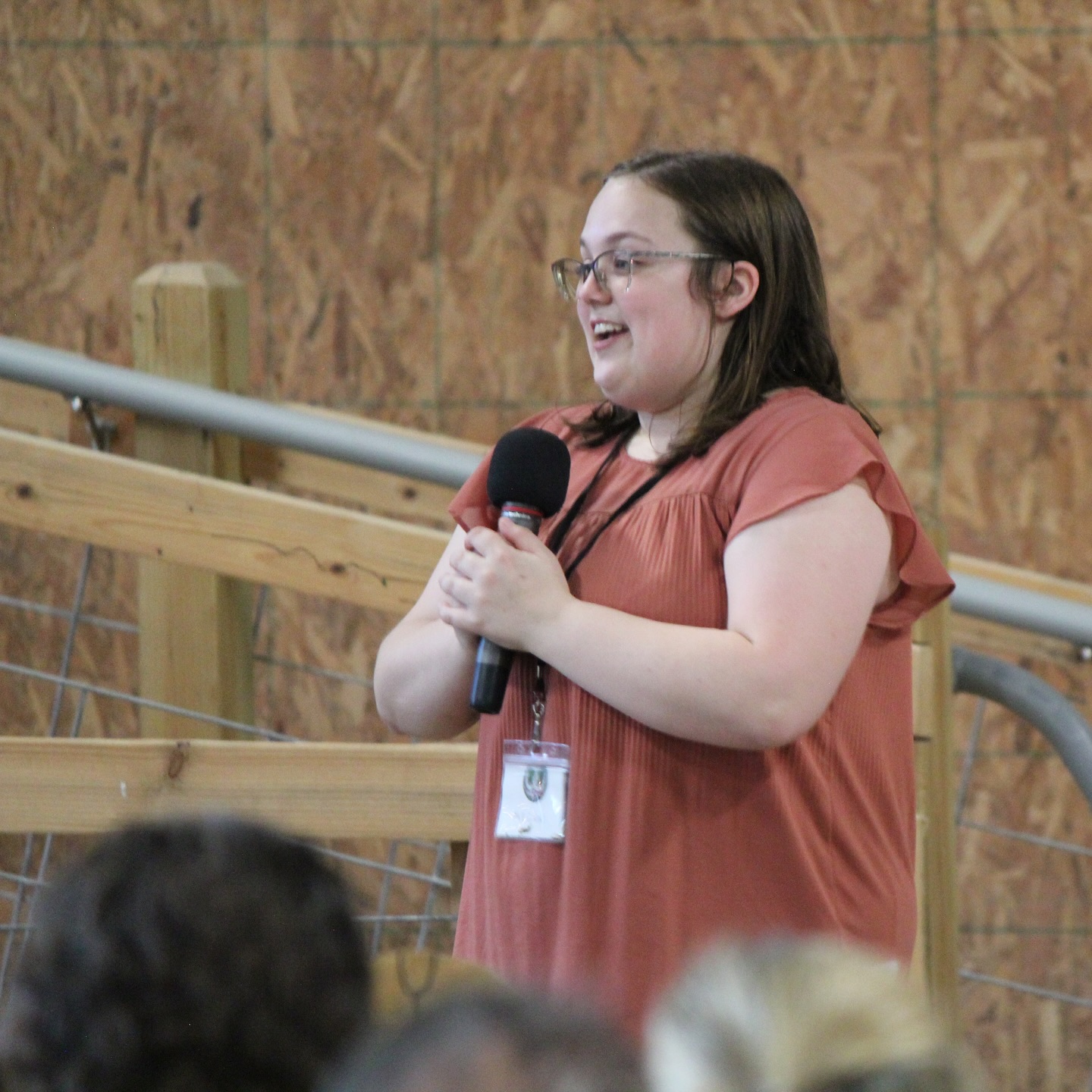 A student speaks to a group.