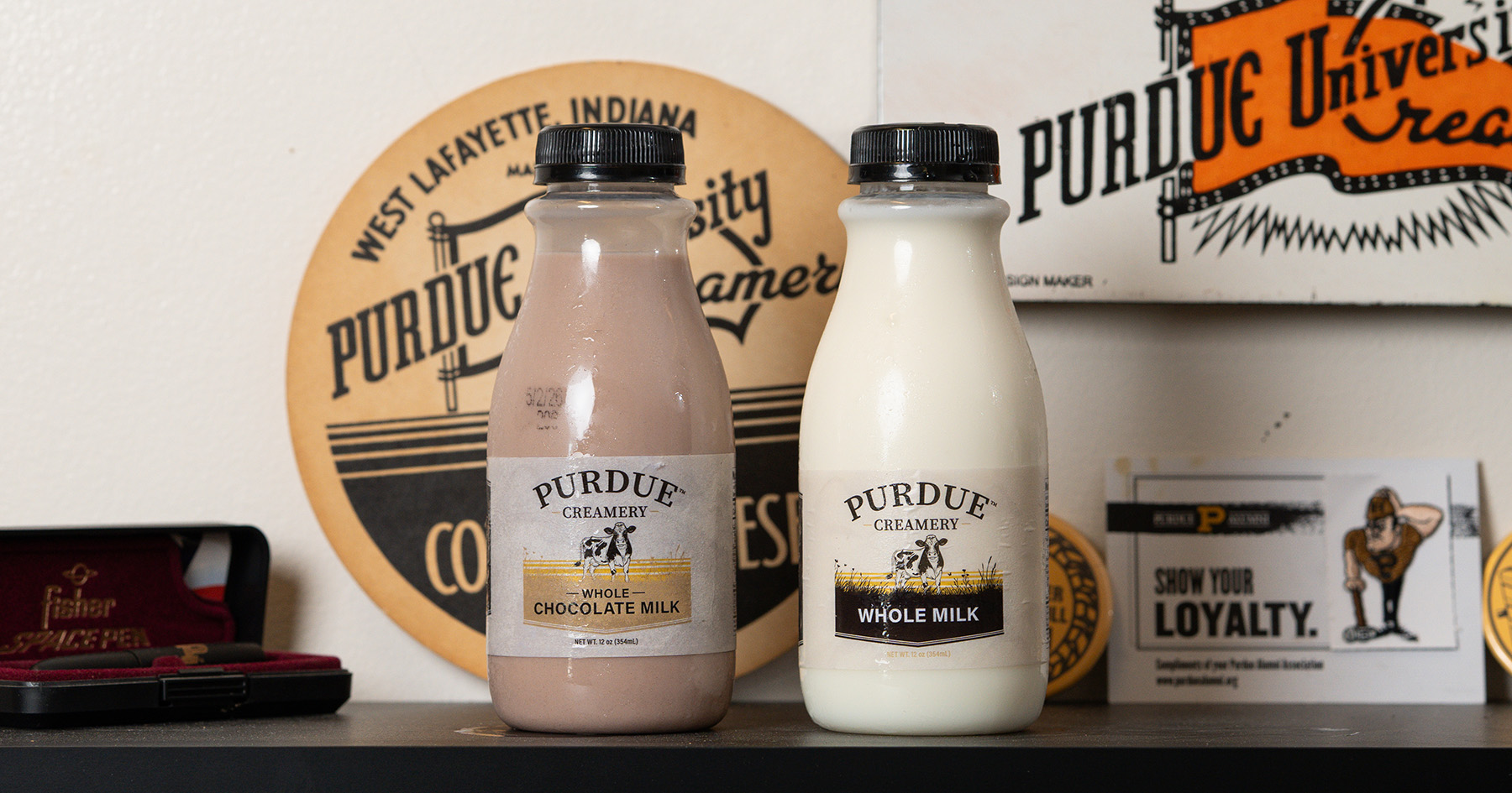 Two bottles of Purdue Creamery's milk: whole white and chocolate