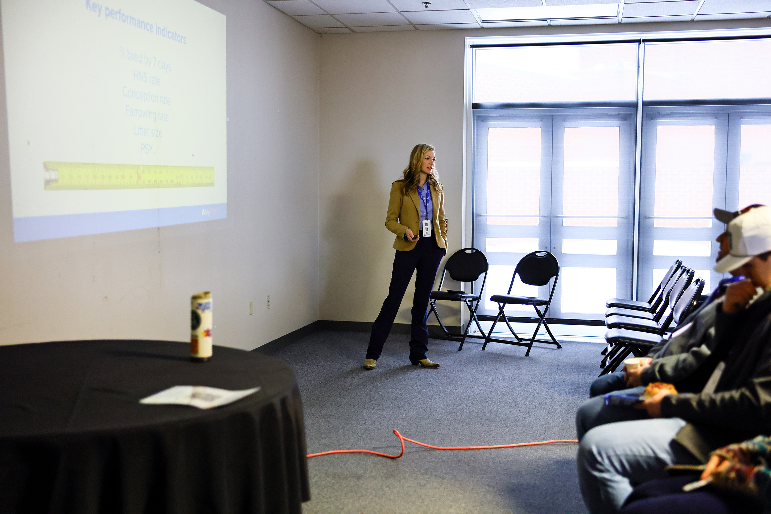 Amanda Minton speaks with a group of people.