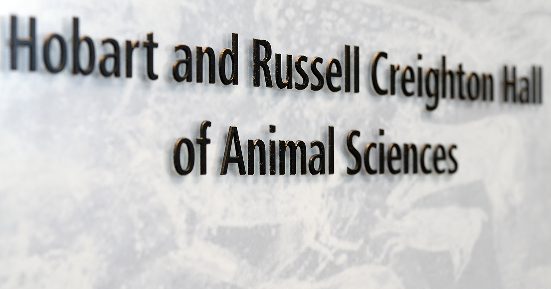A sign reading "Hobart and Russell Creighton Hall of Animal Sciences."