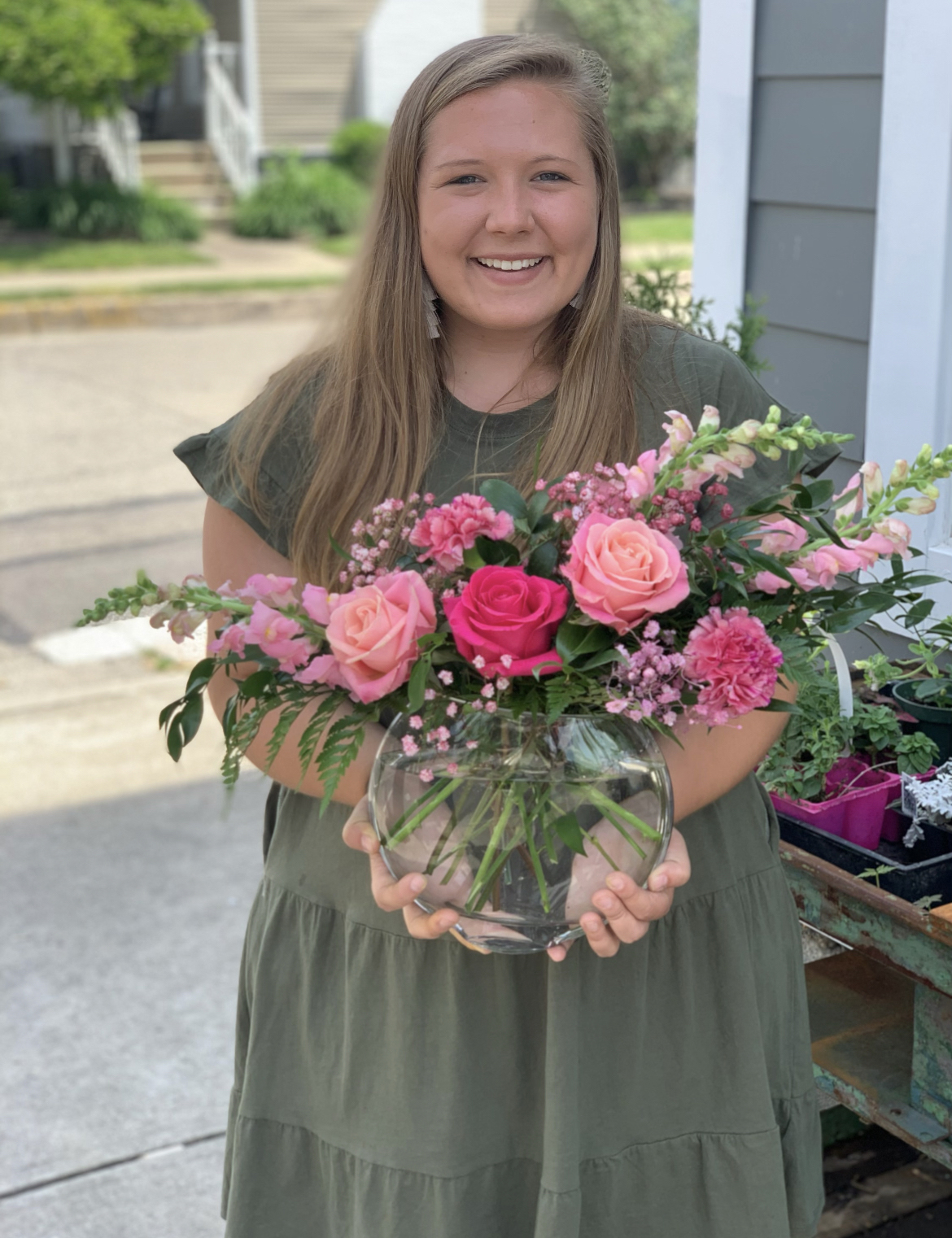 Emily Wendel holds a bouquet of flowers