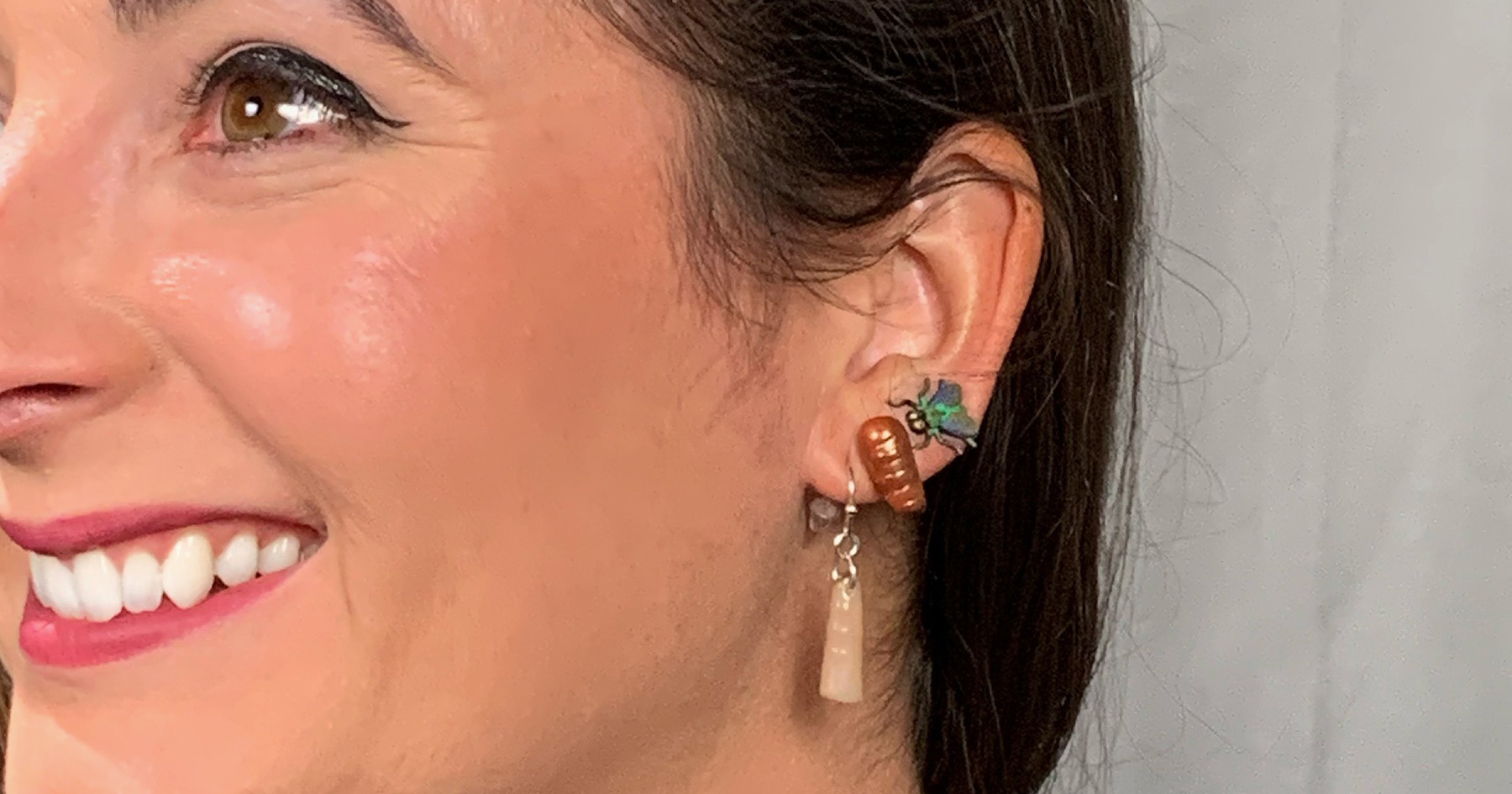 Krystal Hans shows off her insect jewelry