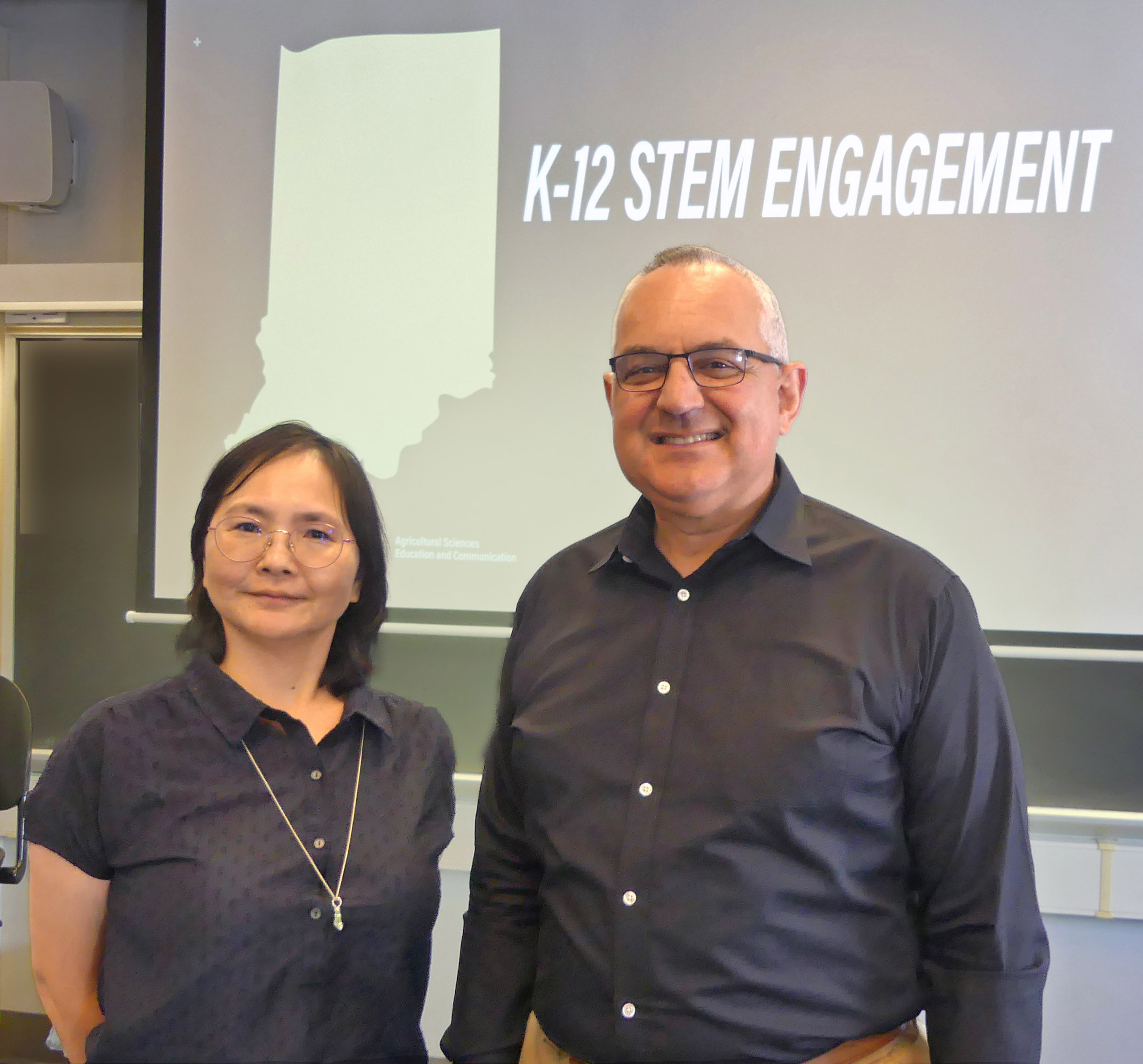 Drs. Wang and Knobloch in a classroom