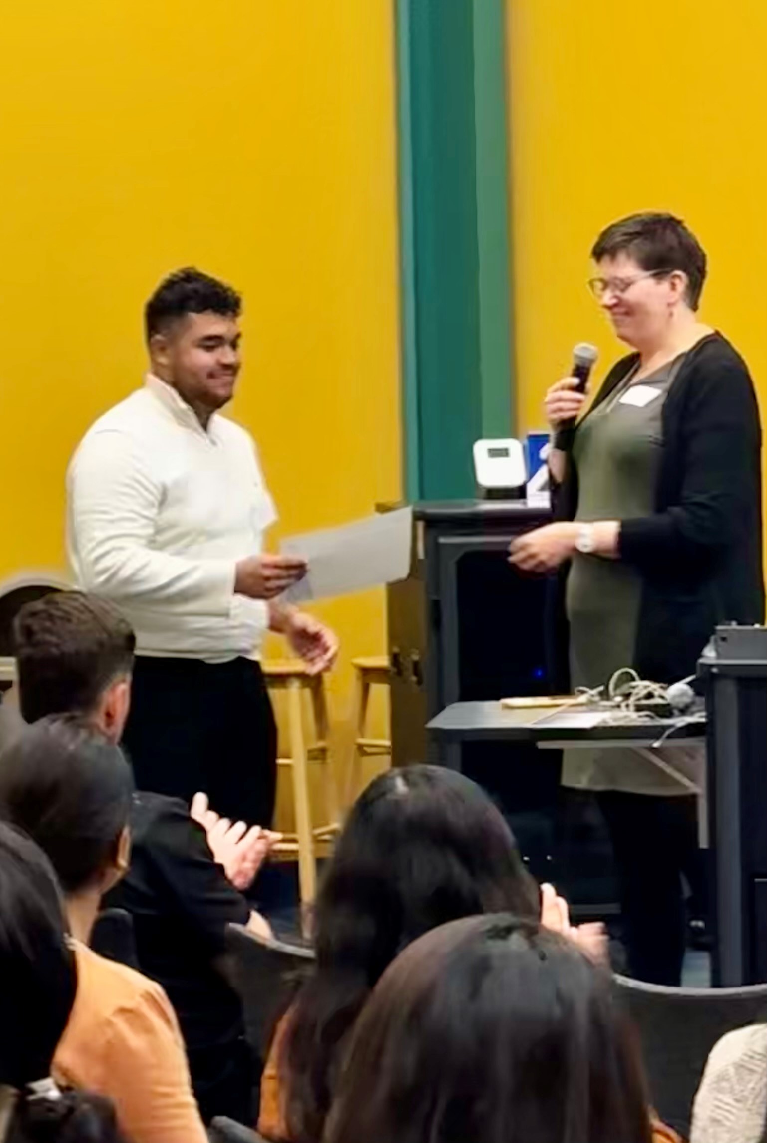 student accepting award