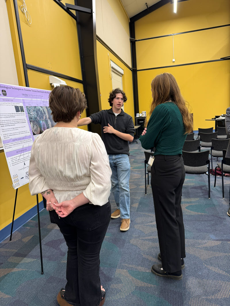 People viewing research poster