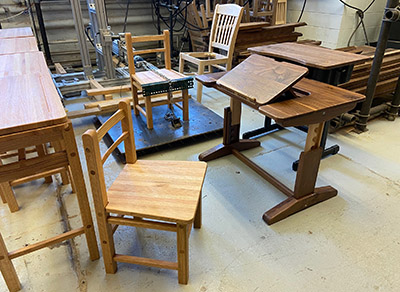 School furniture - a chair and an adjustable desk - made by the Purdue Wood Research Lab