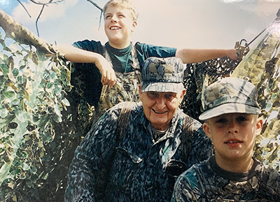 Adam Janke (bottom right) with his brother and grandpa in Indiana as a child