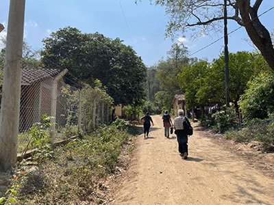 The Bolivia research team walking through a local village