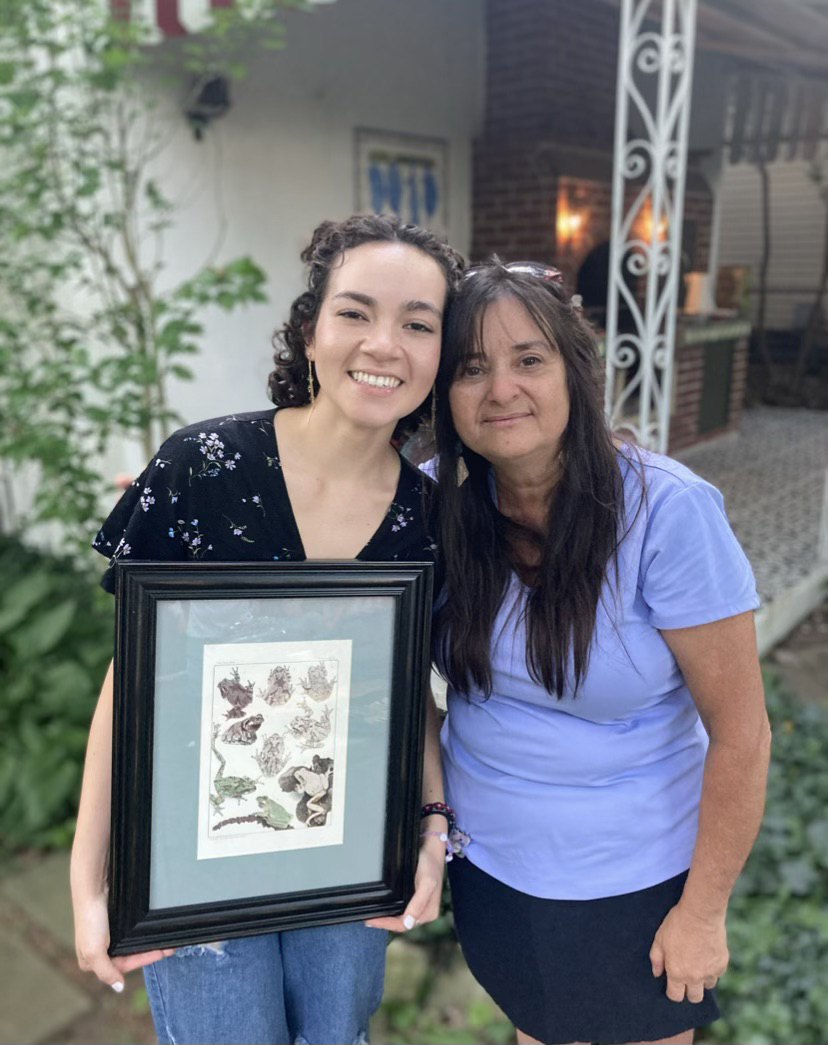 Evelyn Barragan and Marisol Sepulveda with a framed picture