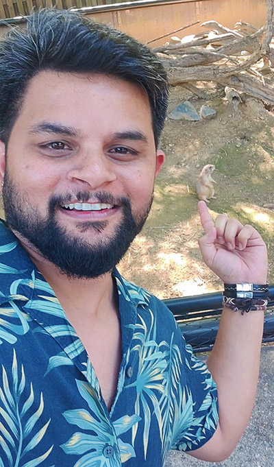 Dr. Abhinav Tyagi points to an animal behind him.