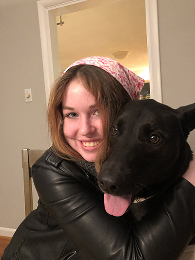 Alex Early poses with her dog