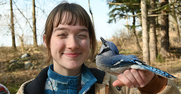 Allie Johnson holds a bluejay