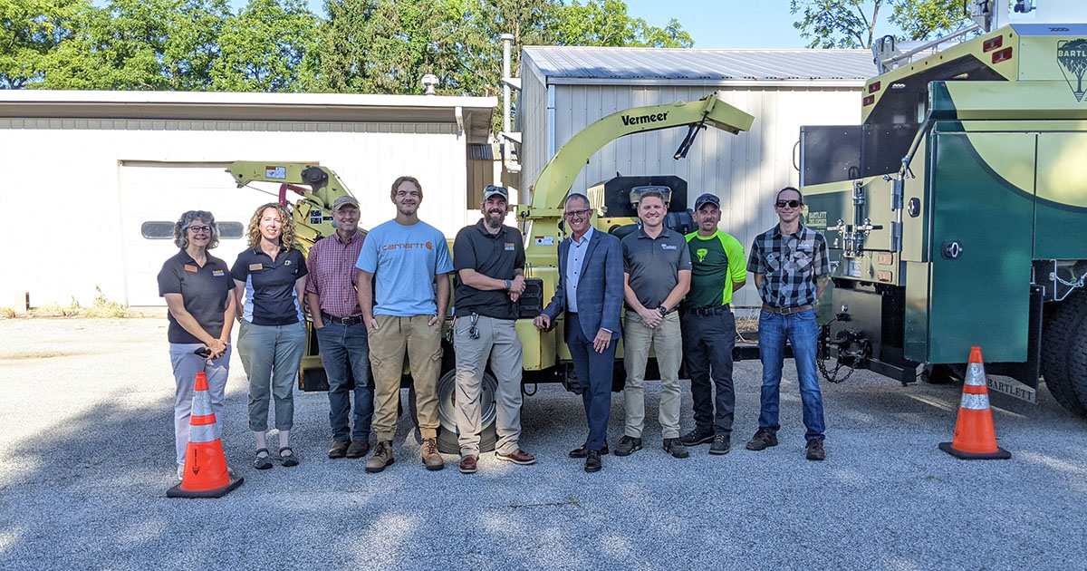 Representatives from Purdue FNR and Bartlett Tree Company with the donated chipper. From left to right: Liz Jackson, Liz Flaherty, Brian Beheler, Forest Summerfield and Ben McCallister from FNR and Scott Jamieson, Sean Rock, Kyle Armstrong and Zach Nemeth from Bartlett