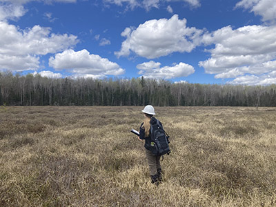 Elena Boughton walks through a field