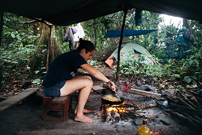 Ruth Bowers-Sword making food in her tent in Equatorial Guinea