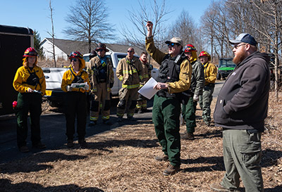 Jarred Brooke instructs his class before a prescribed burn in spring 2026 at the Celery Bog.