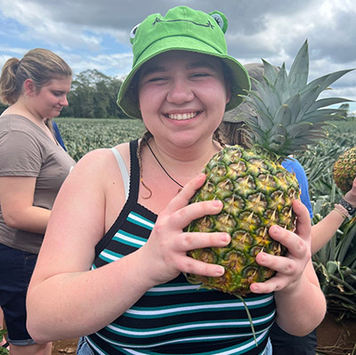 Brynna Buckmaster holds a pineapple