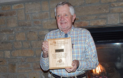 Joe Schuerman Jr. with his John F. Datena Distinguished Forester Award