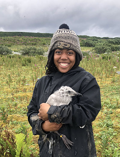 Gabby Dennis with a 25-day old glaucous-winged gull. 