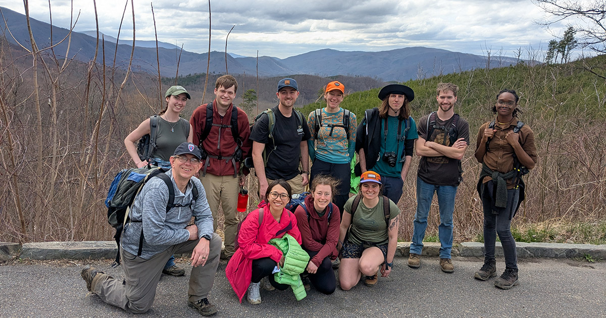The Ecology of Natural Disturbances class stands in front of the Smoky Mountains. 