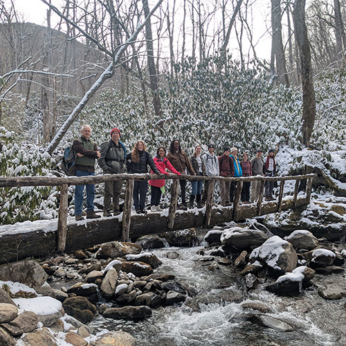 The Ecology of Natural Disturbances class stands in front of the Smoky Mountains. 