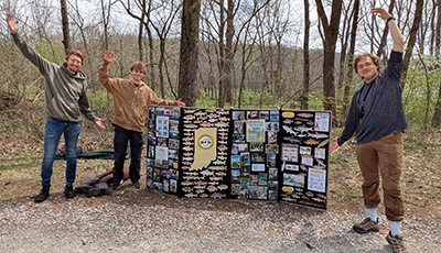 Liam Doski (right) stands next to the American Fisheries Society display at 2026 Community Nature Day.
