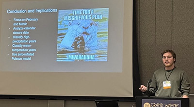 Liam Doski presents his research on otters at the Midwest Fish and Wildlife Conference.