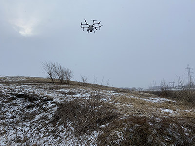 Drone seeding a field