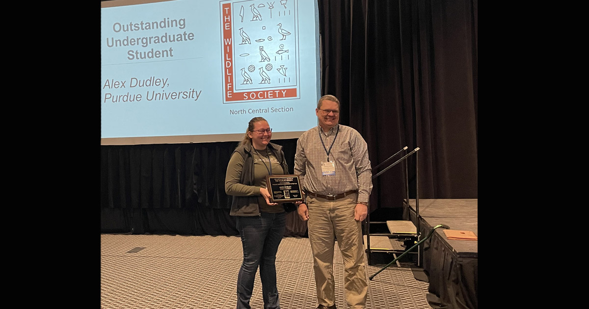 Alex Dudley receives her award for Outstanding Undergraduate Student for the North Central Section of The Wildlife Society.