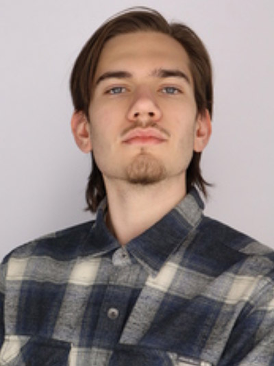 A headshot of Ethan Enochian