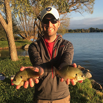 Zach Feiner holds two bluegill sunfish