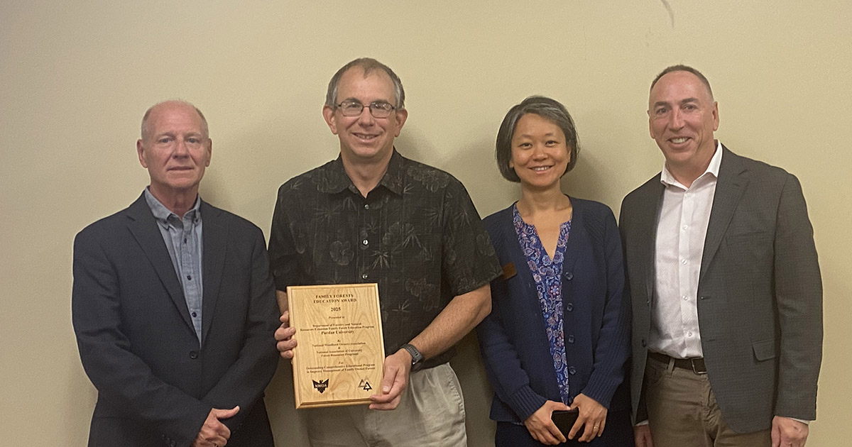 Drs. Mike Saunders and Zhao Ma pose with the Family Forests Comprehensive Education Program Award presented by National Woodland Owners Association (NWOA) and National Association of University Forest Resources Programs (NAUFRP). 