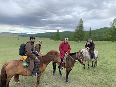 Fran on horseback riding up the sacred mountain