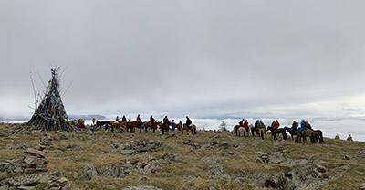 An ovoo ceremony atop the sacred mountain.
